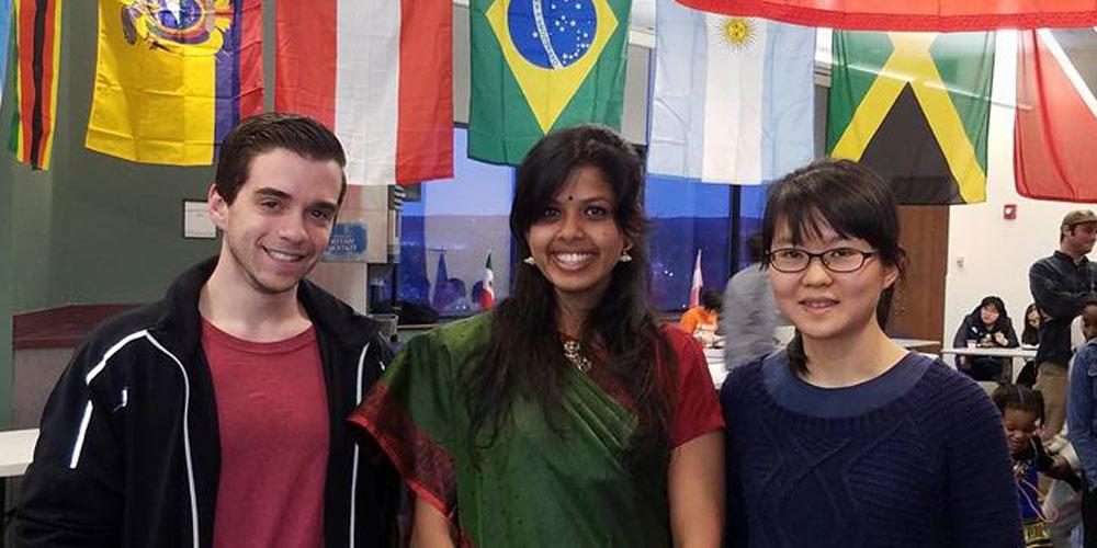 Students behind flags at International Festival